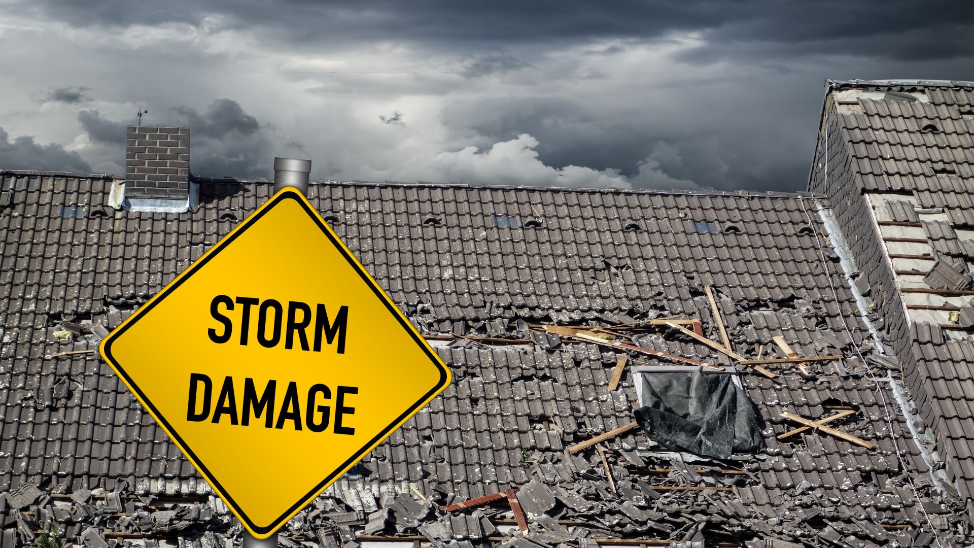 A yellow warning sign reading Storm Damage stands in front of a severely damaged roof covered in debris, with dark storm clouds looming in the background.